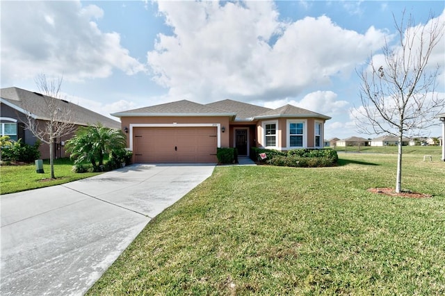 view of front of house featuring a garage and a front lawn