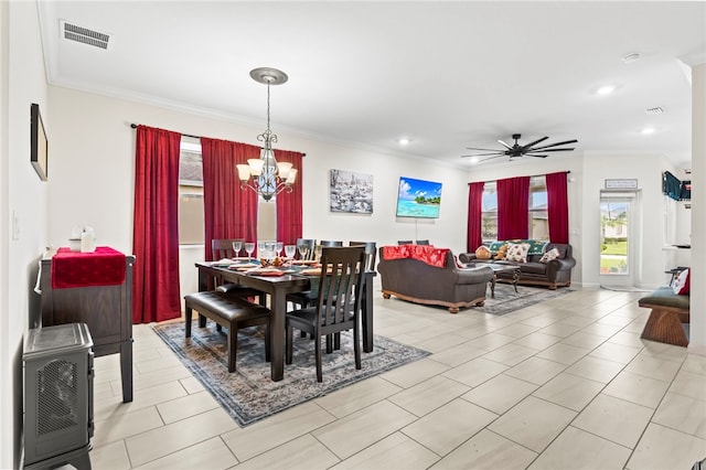 dining room featuring heating unit, visible vents, recessed lighting, and crown molding