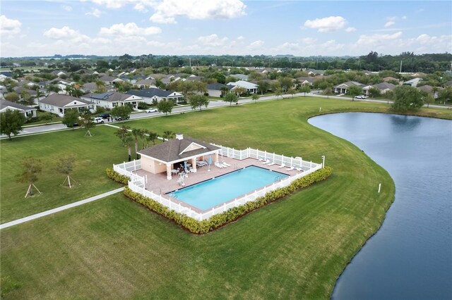 aerial view featuring a residential view and a water view