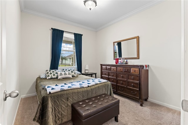 bedroom featuring ornamental molding, baseboards, and light carpet