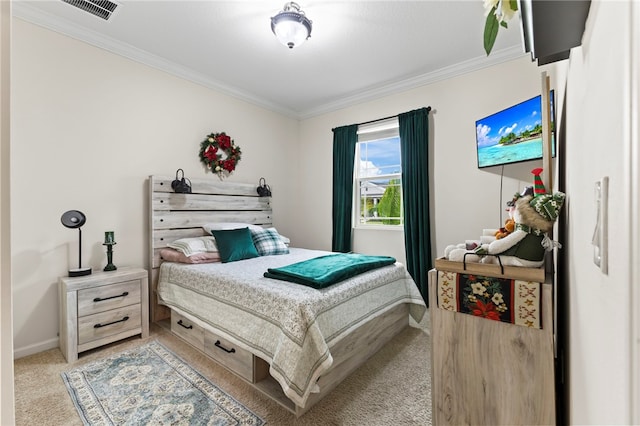 bedroom featuring baseboards, light colored carpet, visible vents, and ornamental molding