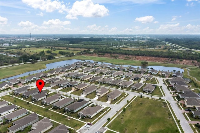 bird's eye view with a residential view, view of golf course, and a water view