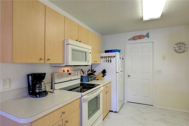 kitchen featuring white appliances, a textured ceiling, and light brown cabinetry