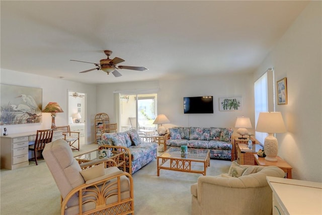 carpeted living room featuring ceiling fan