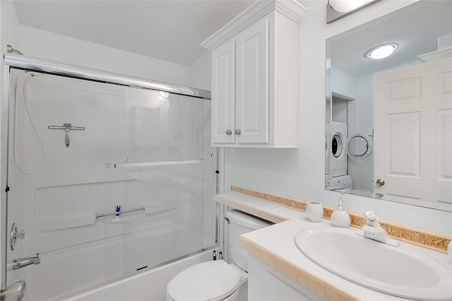 5367 Montego Cir, Hutchinson Island, FL 34949 - full bathroom with toilet, enclosed tub / shower combo, vanity, and washing machine and dryer