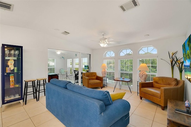 5367 Montego Cir, Hutchinson Island, FL 34949 - living room featuring light tile patterned floors, ceiling fan, and plenty of natural light