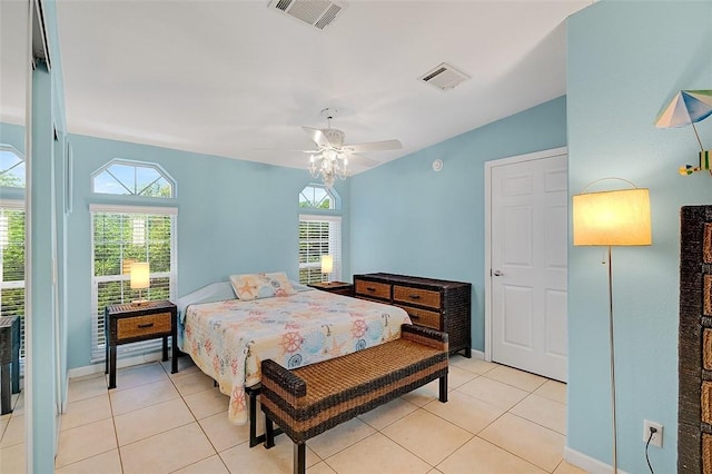 5367 Montego Cir, Hutchinson Island, FL 34949 - bedroom featuring light tile patterned floors, ceiling fan, lofted ceiling, and baseboards