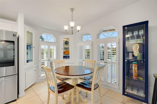 5367 Montego Cir, Hutchinson Island, FL 34949 - dining space featuring light tile patterned floors and a chandelier