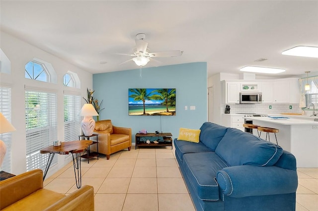 5367 Montego Cir, Hutchinson Island, FL 34949 - living room with light tile patterned floors and a ceiling fan
