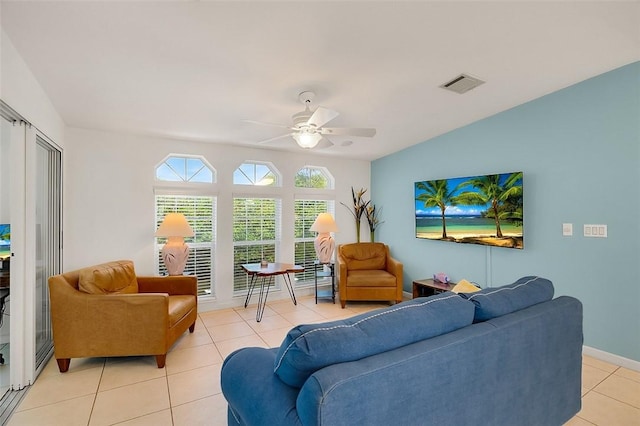 5367 Montego Cir, Hutchinson Island, FL 34949 - living area with light tile patterned flooring, ceiling fan, and baseboards