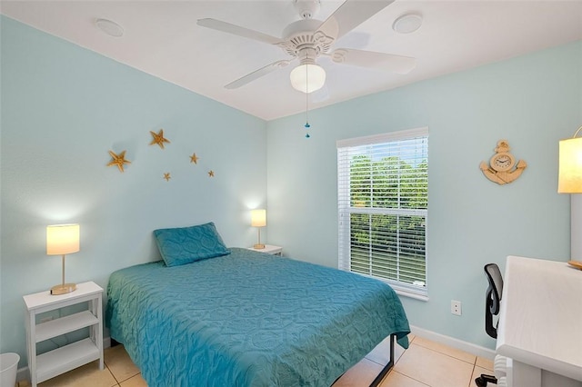 5367 Montego Cir, Hutchinson Island, FL 34949 - bedroom with light tile patterned floors, baseboards, and a ceiling fan