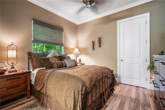 bedroom with hardwood / wood-style flooring and ceiling fan