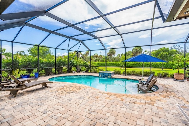 view of swimming pool featuring a patio area and a lanai