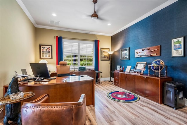 office area featuring crown molding, ceiling fan, and light hardwood / wood-style floors