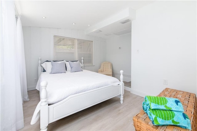 bedroom with light hardwood / wood-style flooring