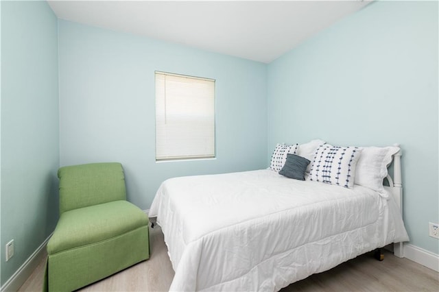 bedroom with light hardwood / wood-style floors