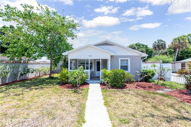 bungalow with a front yard