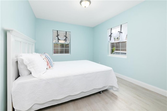 bedroom with light hardwood / wood-style flooring