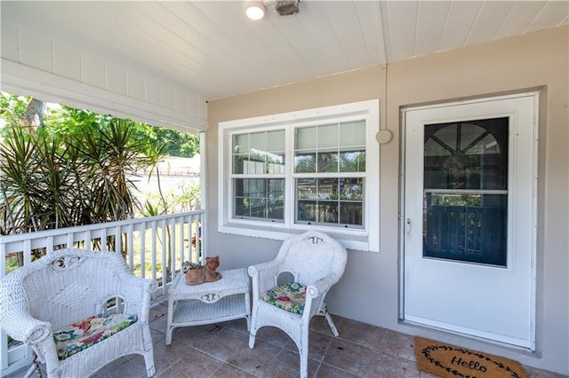 view of exterior entry featuring a porch