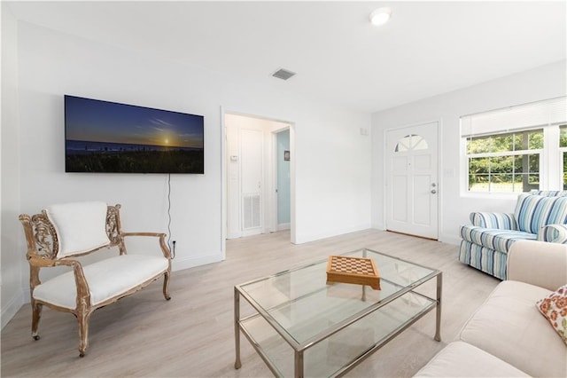 living room with light hardwood / wood-style flooring