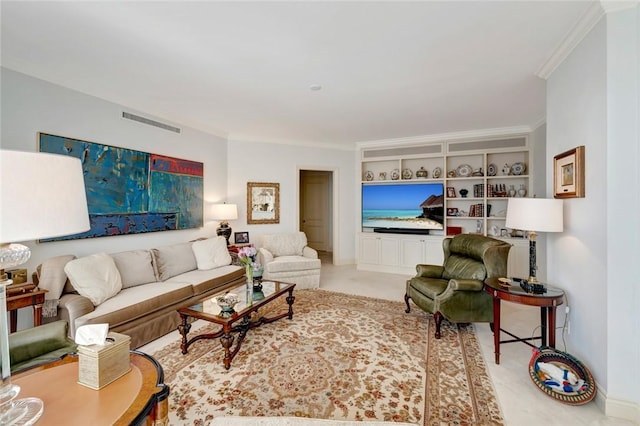 living room with built in features and ornamental molding