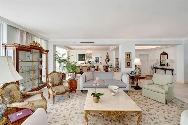 living room featuring an inviting chandelier and crown molding