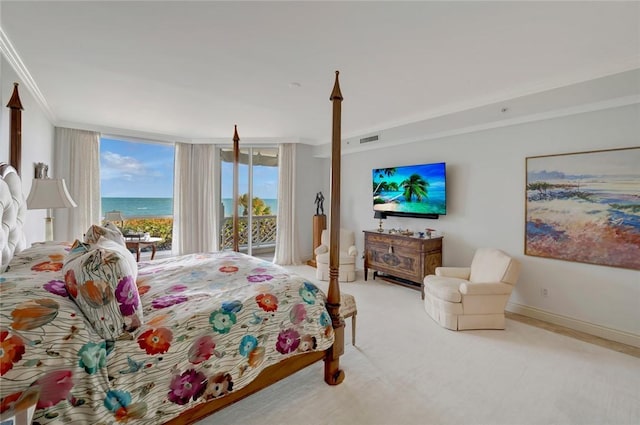 carpeted bedroom with access to outside, floor to ceiling windows, and crown molding