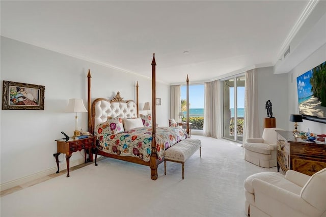 bedroom with floor to ceiling windows, light colored carpet, ornamental molding, and access to outside