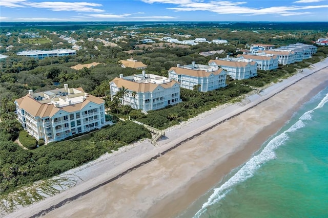 birds eye view of property featuring a view of the beach and a water view