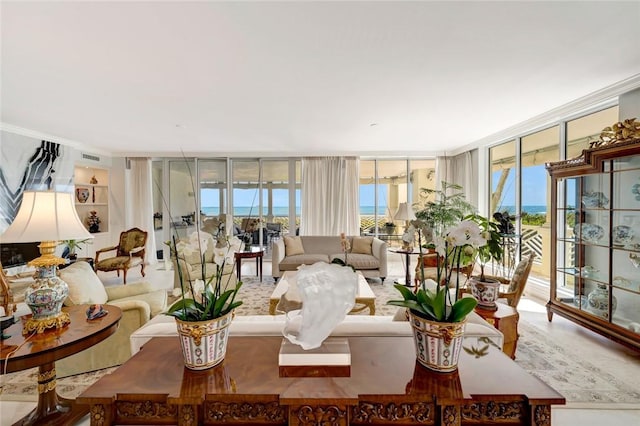 living room with floor to ceiling windows and crown molding