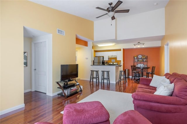 5095 Fairways Cir Unit I304, Vero Beach, FL 32967 - living room featuring a ceiling fan, wood finished floors, and a high ceiling