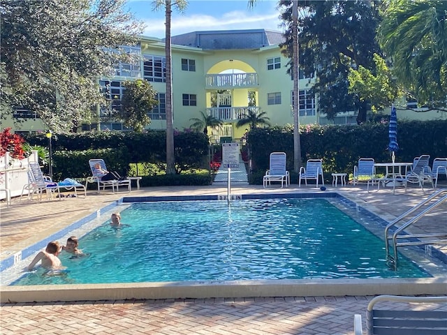 view of swimming pool with a patio area