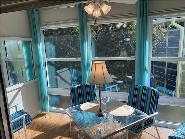 sunroom featuring ceiling fan