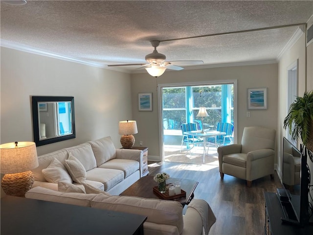 living room featuring a textured ceiling, hardwood / wood-style flooring, ceiling fan, and ornamental molding