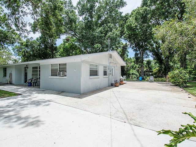 view of home's exterior featuring a patio and cooling unit