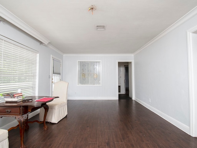 sitting room with dark hardwood / wood-style flooring and crown molding