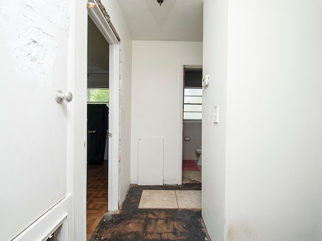 hallway with dark parquet floors