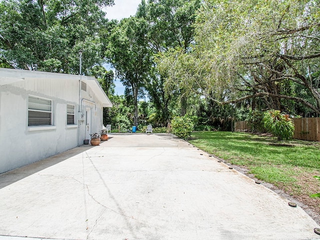 exterior space featuring a patio and a yard