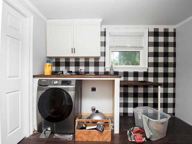 washroom with dark hardwood / wood-style flooring, washer / clothes dryer, cabinets, and crown molding