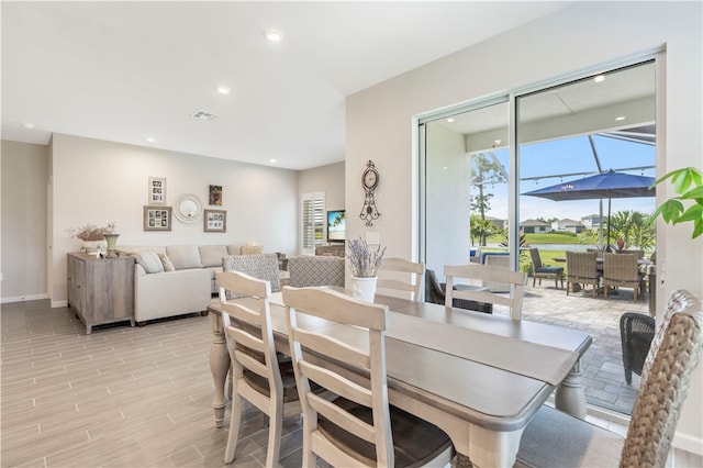 dining room featuring light hardwood / wood-style floors and plenty of natural light