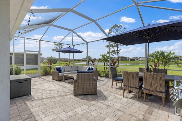 view of patio / terrace with glass enclosure and an outdoor living space