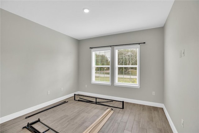 spare room with light hardwood / wood-style floors