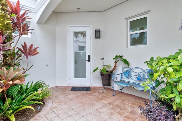 entrance to property with a patio