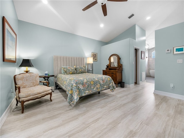 bedroom with connected bathroom, light wood-type flooring, lofted ceiling, and ceiling fan