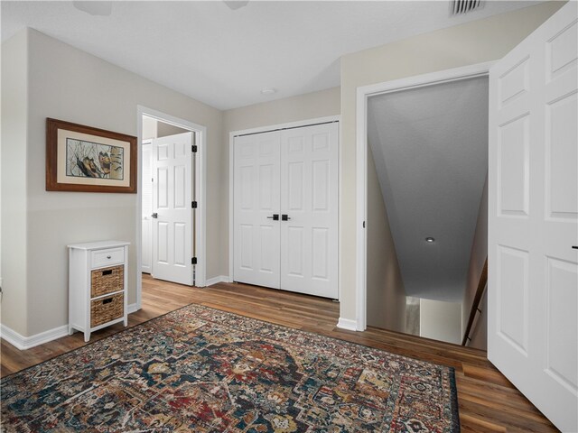 bedroom with hardwood / wood-style flooring and a closet