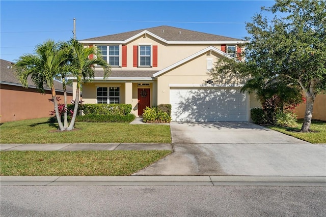 view of front of property featuring a garage and a front lawn