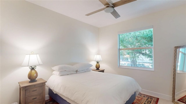 bedroom with baseboards and ceiling fan