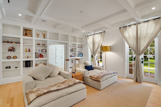 sitting room featuring coffered ceiling, hardwood / wood-style floors, and beamed ceiling