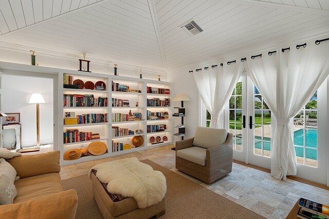 living area featuring french doors, lofted ceiling, and wood ceiling