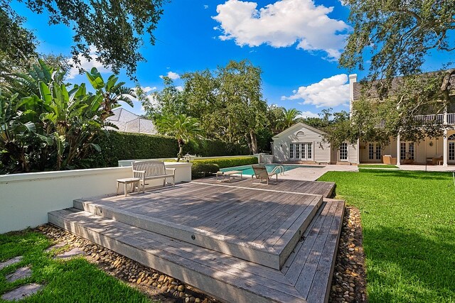 exterior space with a lawn and a deck